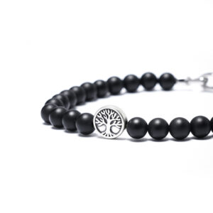 Close-up of matte black onyx bead bracelet for men featuring a tree of life silver bead