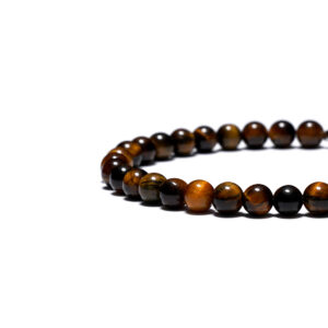 Men’s yellow tiger eye bracelet photographed on dark background for a masculine look