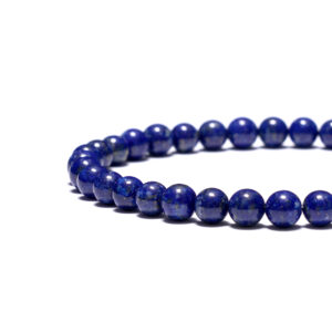 Men’s lapis lazuli bracelet on wrist, showcasing refined masculine design