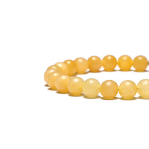 Minimalist beige jade bracelet for men flat lay