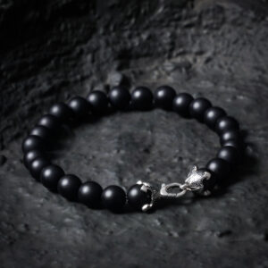 Men’s black onyx anchor bracelet showing four-point anchor clasp design