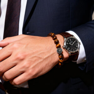 Men’s yellow tiger eye bracelet styled with watch for a refined masculine look