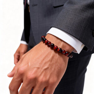 Red tiger eye bracelet styled with casual menswear for a modern and grounded look