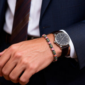 business man wearing serpentine jasper bracelet with watch
