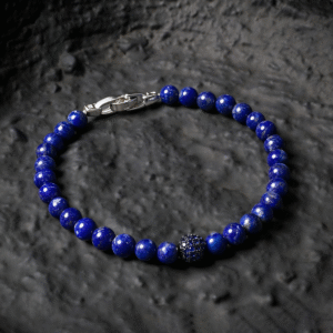 Close-up of lapis lazuli diamond bracelet with deep blue stones and silver accent