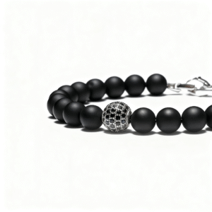 Minimalist men’s black onyx bracelet with diamond accent on white background