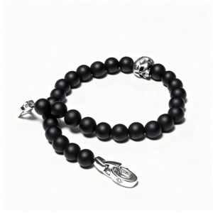 Men’s black onyx bracelet featuring silver skull detail