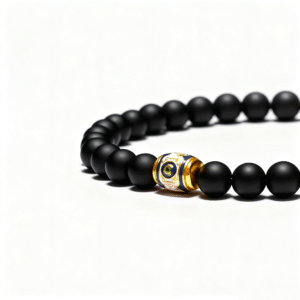 Three-eyed core bead detail on men’s black onyx bracelet