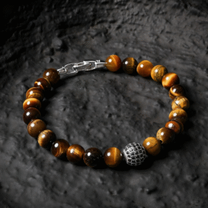 Yellow tiger eye diamond bead bracelet displayed on a dark textured surface