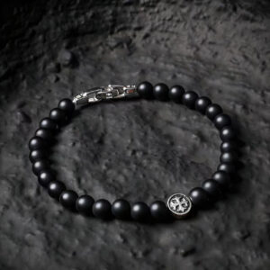 Men’s black onyx bracelet with symbolic round cross
