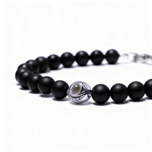Close-up of men’s black onyx evil eye projection bead bracelet, matte natural stones