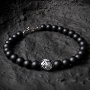 Men’s black onyx evil eye projection bracelet on dark stone background, masculine style